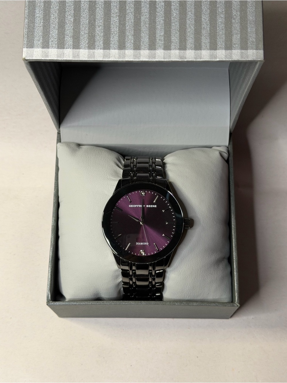 Geoffrey Beene Black Stainless Steel Watch with Purple Sunburst Dial